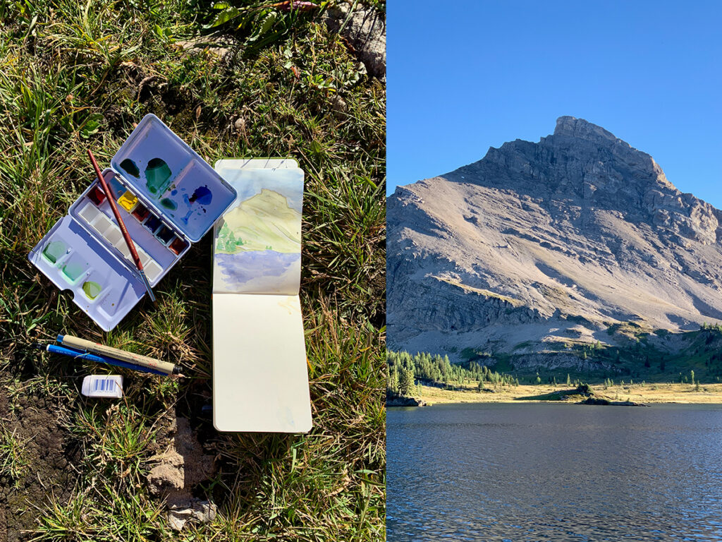 Watercolour painting a mountain at Baker Lake Campground on Skoki Loop during a Banff hiking trips